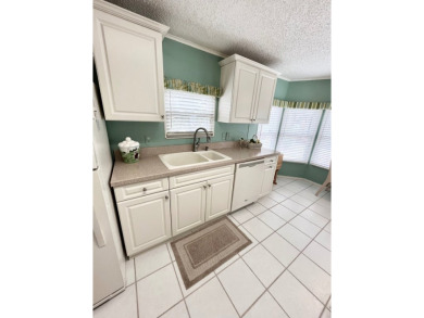 Welcome to this beautifully cared-for home in the gated golf on Pine Lakes Country Club in Florida - for sale on GolfHomes.com, golf home, golf lot