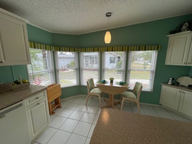 Welcome to this beautifully cared-for home in the gated golf on Pine Lakes Country Club in Florida - for sale on GolfHomes.com, golf home, golf lot