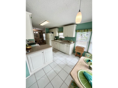 Welcome to this beautifully cared-for home in the gated golf on Pine Lakes Country Club in Florida - for sale on GolfHomes.com, golf home, golf lot