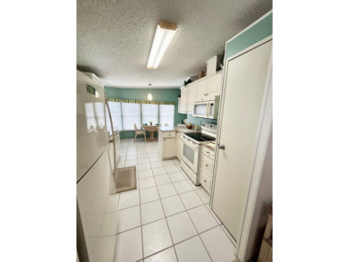 Welcome to this beautifully cared-for home in the gated golf on Pine Lakes Country Club in Florida - for sale on GolfHomes.com, golf home, golf lot