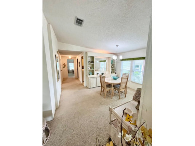 Welcome to this beautifully cared-for home in the gated golf on Pine Lakes Country Club in Florida - for sale on GolfHomes.com, golf home, golf lot