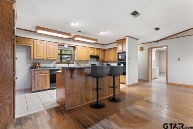 This home has so much potential and offers an affordable entry on Hide-A-Way Lake Golf Course in Texas - for sale on GolfHomes.com, golf home, golf lot
