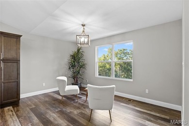 This must-see 3-bedroom, 2-full bath residence is situated on on Raintree Country Club in Missouri - for sale on GolfHomes.com, golf home, golf lot