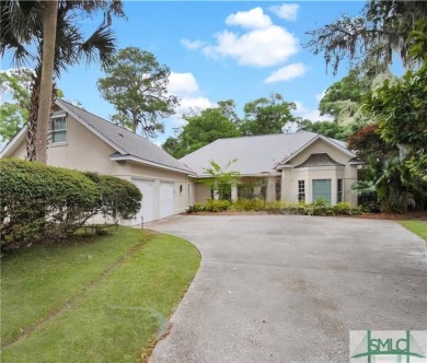 Large garage with full bonus above garage and full bath. Brick on The Landings Club - Palmetto in Georgia - for sale on GolfHomes.com, golf home, golf lot