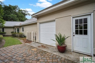 Large garage with full bonus above garage and full bath. Brick on The Landings Club - Palmetto in Georgia - for sale on GolfHomes.com, golf home, golf lot