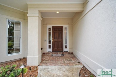 Large garage with full bonus above garage and full bath. Brick on The Landings Club - Palmetto in Georgia - for sale on GolfHomes.com, golf home, golf lot