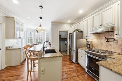 Welcome home to this charming Southern Living style home tucked on The Providence Club in Georgia - for sale on GolfHomes.com, golf home, golf lot