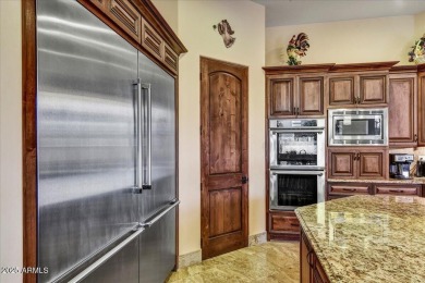 Experience luxury in this netzero, solar-powered on Superstition Mountain Club - Lost Gold in Arizona - for sale on GolfHomes.com, golf home, golf lot