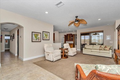 This thoughtfully expanded Jacaranda model offers 4 bedrooms, 3 on Summerglen Country Club in Florida - for sale on GolfHomes.com, golf home, golf lot