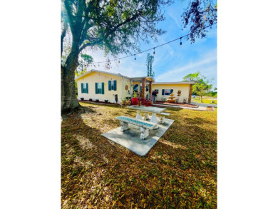 This charming two-bedroom, two-bathroom home is nestled in a on Pine Lakes Country Club in Florida - for sale on GolfHomes.com, golf home, golf lot