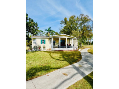 This charming two-bedroom, two-bathroom home is nestled in a on Pine Lakes Country Club in Florida - for sale on GolfHomes.com, golf home, golf lot