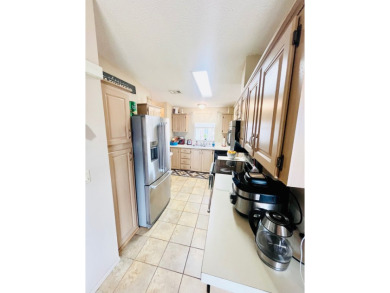 This charming two-bedroom, two-bathroom home is nestled in a on Pine Lakes Country Club in Florida - for sale on GolfHomes.com, golf home, golf lot