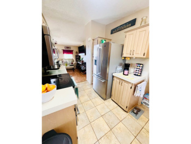 This charming two-bedroom, two-bathroom home is nestled in a on Pine Lakes Country Club in Florida - for sale on GolfHomes.com, golf home, golf lot