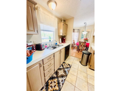 This charming two-bedroom, two-bathroom home is nestled in a on Pine Lakes Country Club in Florida - for sale on GolfHomes.com, golf home, golf lot