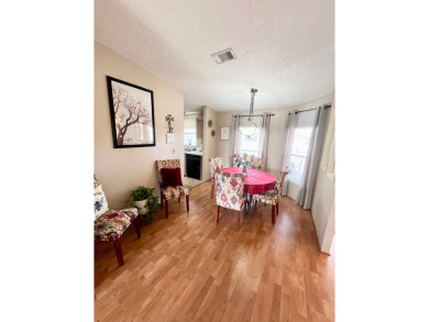 This charming two-bedroom, two-bathroom home is nestled in a on Pine Lakes Country Club in Florida - for sale on GolfHomes.com, golf home, golf lot