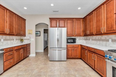This thoughtfully expanded Jacaranda model offers 4 bedrooms, 3 on Summerglen Country Club in Florida - for sale on GolfHomes.com, golf home, golf lot