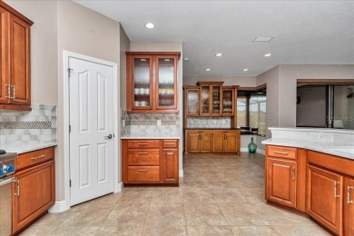This thoughtfully expanded Jacaranda model offers 4 bedrooms, 3 on Summerglen Country Club in Florida - for sale on GolfHomes.com, golf home, golf lot
