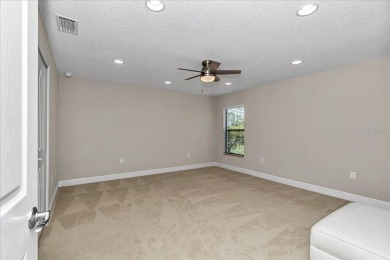 This thoughtfully expanded Jacaranda model offers 4 bedrooms, 3 on Summerglen Country Club in Florida - for sale on GolfHomes.com, golf home, golf lot