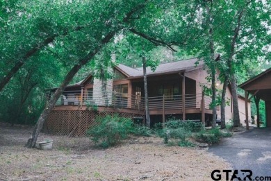 Welcome to this charming home nestled within the private, gated on Holly Lake Ranch Golf Club in Texas - for sale on GolfHomes.com, golf home, golf lot