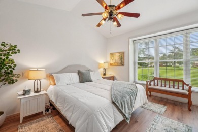 Stunning golf course, pond, and bridge views surround this on Bushwood Golf Club in Michigan - for sale on GolfHomes.com, golf home, golf lot