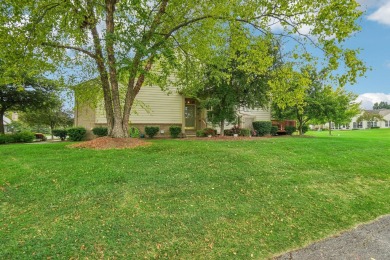 Stunning golf course, pond, and bridge views surround this on Bushwood Golf Club in Michigan - for sale on GolfHomes.com, golf home, golf lot