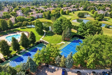 Stunning golf course, pond, and bridge views surround this on Bushwood Golf Club in Michigan - for sale on GolfHomes.com, golf home, golf lot