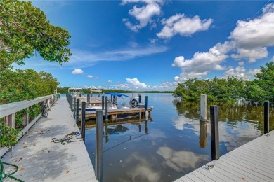 Welcome to this beautifully updated 3-bedroom, 2-bathroom lake on Pelicans Nest Golf Club in Florida - for sale on GolfHomes.com, golf home, golf lot