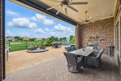 Situated directly on the 5th green, this luxury residence offers on Wildhorse Golf Club of Robson Ranch in Texas - for sale on GolfHomes.com, golf home, golf lot