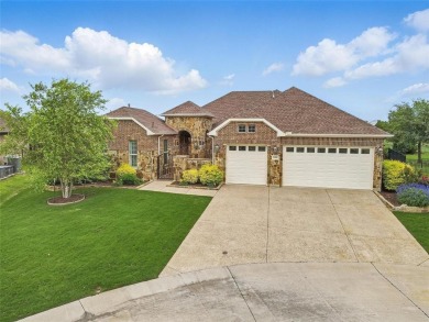 Situated directly on the 5th green, this luxury residence offers on Wildhorse Golf Club of Robson Ranch in Texas - for sale on GolfHomes.com, golf home, golf lot