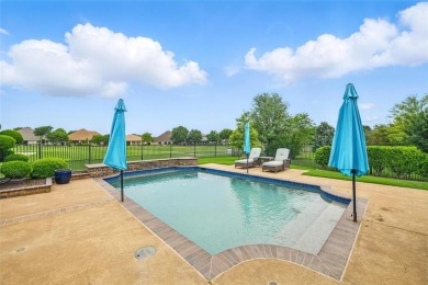Situated directly on the 5th green, this luxury residence offers on Wildhorse Golf Club of Robson Ranch in Texas - for sale on GolfHomes.com, golf home, golf lot