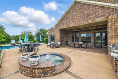Situated directly on the 5th green, this luxury residence offers on Wildhorse Golf Club of Robson Ranch in Texas - for sale on GolfHomes.com, golf home, golf lot