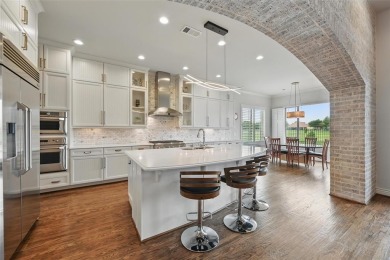 Situated directly on the 5th green, this luxury residence offers on Wildhorse Golf Club of Robson Ranch in Texas - for sale on GolfHomes.com, golf home, golf lot