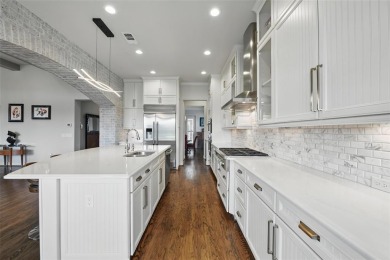 Situated directly on the 5th green, this luxury residence offers on Wildhorse Golf Club of Robson Ranch in Texas - for sale on GolfHomes.com, golf home, golf lot
