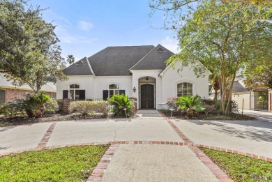 Welcome to this stunning two-story, 5-bedroom, 4.5-bath home on University Club in Louisiana - for sale on GolfHomes.com, golf home, golf lot