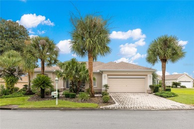 Luxurious Hampton model boasts French glass double French doors on Eagle Ridge At Spruce Creek Country Club in Florida - for sale on GolfHomes.com, golf home, golf lot