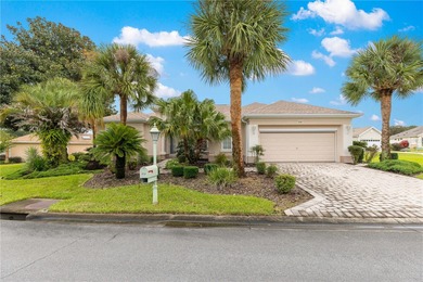 Luxurious Hampton model boasts French glass double French doors on Eagle Ridge At Spruce Creek Country Club in Florida - for sale on GolfHomes.com, golf home, golf lot