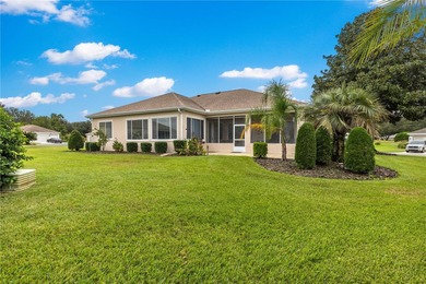 Luxurious Hampton model boasts French glass double French doors on Eagle Ridge At Spruce Creek Country Club in Florida - for sale on GolfHomes.com, golf home, golf lot