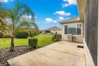 Luxurious Hampton model boasts French glass double French doors on Eagle Ridge At Spruce Creek Country Club in Florida - for sale on GolfHomes.com, golf home, golf lot
