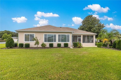 Luxurious Hampton model boasts French glass double French doors on Eagle Ridge At Spruce Creek Country Club in Florida - for sale on GolfHomes.com, golf home, golf lot