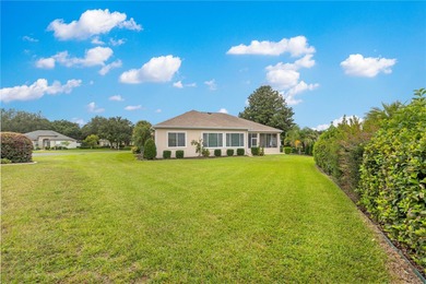 Luxurious Hampton model boasts French glass double French doors on Eagle Ridge At Spruce Creek Country Club in Florida - for sale on GolfHomes.com, golf home, golf lot