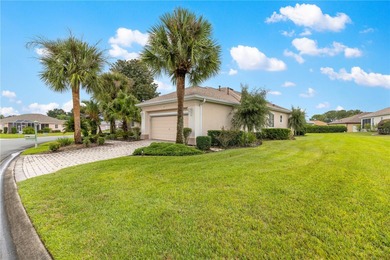 Luxurious Hampton model boasts French glass double French doors on Eagle Ridge At Spruce Creek Country Club in Florida - for sale on GolfHomes.com, golf home, golf lot