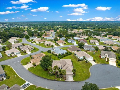 Luxurious Hampton model boasts French glass double French doors on Eagle Ridge At Spruce Creek Country Club in Florida - for sale on GolfHomes.com, golf home, golf lot