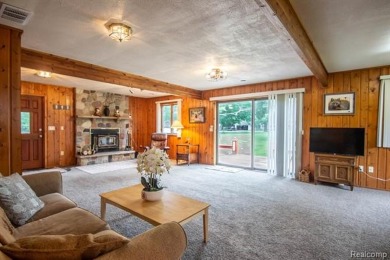 Nestled in the gated community of Lost Lake Woods Club in on Lost Lake Woods Club in Michigan - for sale on GolfHomes.com, golf home, golf lot