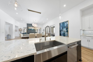 Experience luxury and lifestyle in this exceptional 5-bedroom, 5 on Hasentree Club in North Carolina - for sale on GolfHomes.com, golf home, golf lot
