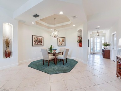 This beautifully maintained corner coach home features the on The Colony Golf and Country Club in Florida - for sale on GolfHomes.com, golf home, golf lot