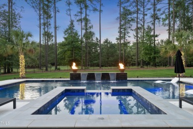 Experience luxury and lifestyle in this exceptional 5-bedroom, 5 on Hasentree Club in North Carolina - for sale on GolfHomes.com, golf home, golf lot