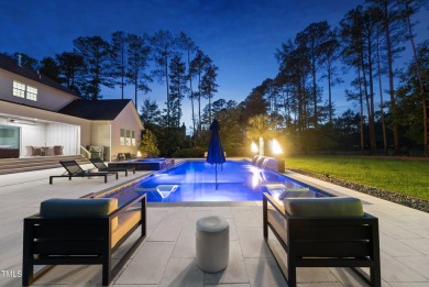 Experience luxury and lifestyle in this exceptional 5-bedroom, 5 on Hasentree Club in North Carolina - for sale on GolfHomes.com, golf home, golf lot