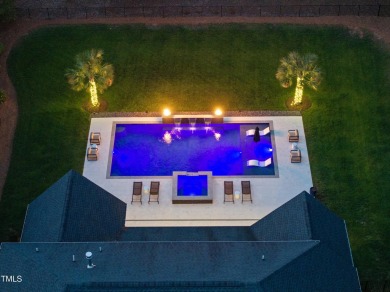 Experience luxury and lifestyle in this exceptional 5-bedroom, 5 on Hasentree Club in North Carolina - for sale on GolfHomes.com, golf home, golf lot