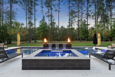 Experience luxury and lifestyle in this exceptional 5-bedroom, 5 on Hasentree Club in North Carolina - for sale on GolfHomes.com, golf home, golf lot