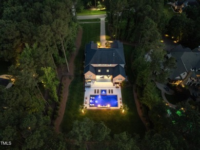 Experience luxury and lifestyle in this exceptional 5-bedroom, 5 on Hasentree Club in North Carolina - for sale on GolfHomes.com, golf home, golf lot